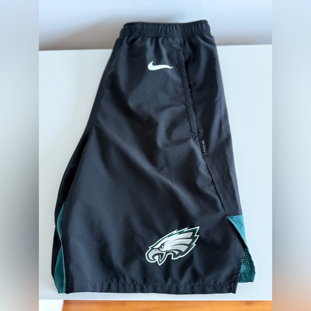 Nike Black Athletic Shorts with Teal Accents and Eagles Logo